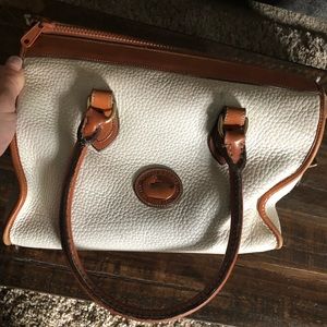 White with brown trim Dooney and Bourke purse.